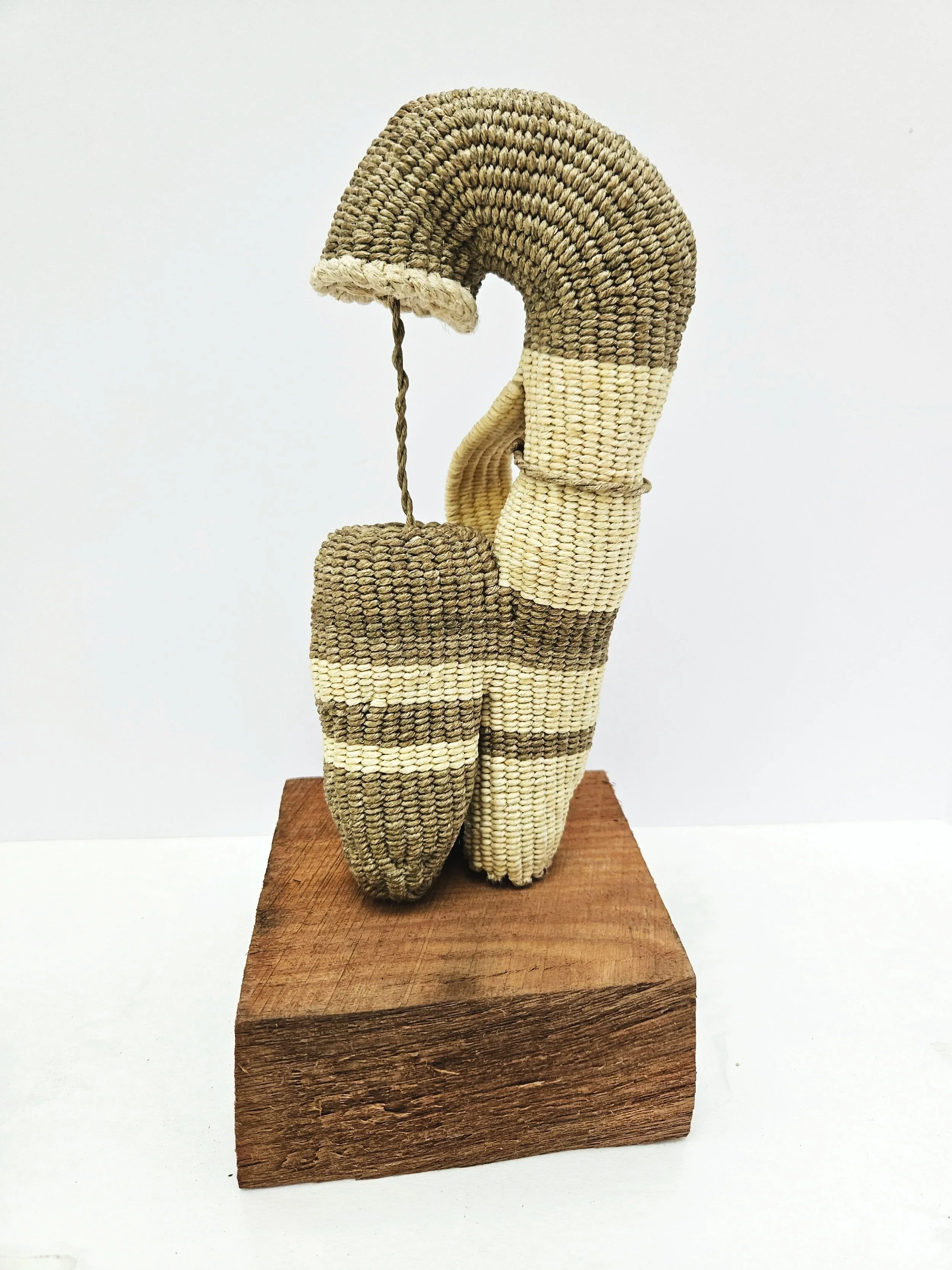 SHARON BURNHAM, 
"Same | Different", 
2026, 
Twining with waxed linen, Italian spring twine, 
9 1⁄2 x 4 x 3 inches on 2 1⁄2 x 5 1/4 x 5 1⁄2 inches wood base (12 x 5 1/4 x 5 1⁄2 inches overall)