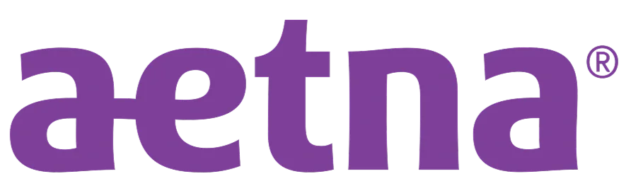A purple logo with the text "aetna" in lowercase letters.