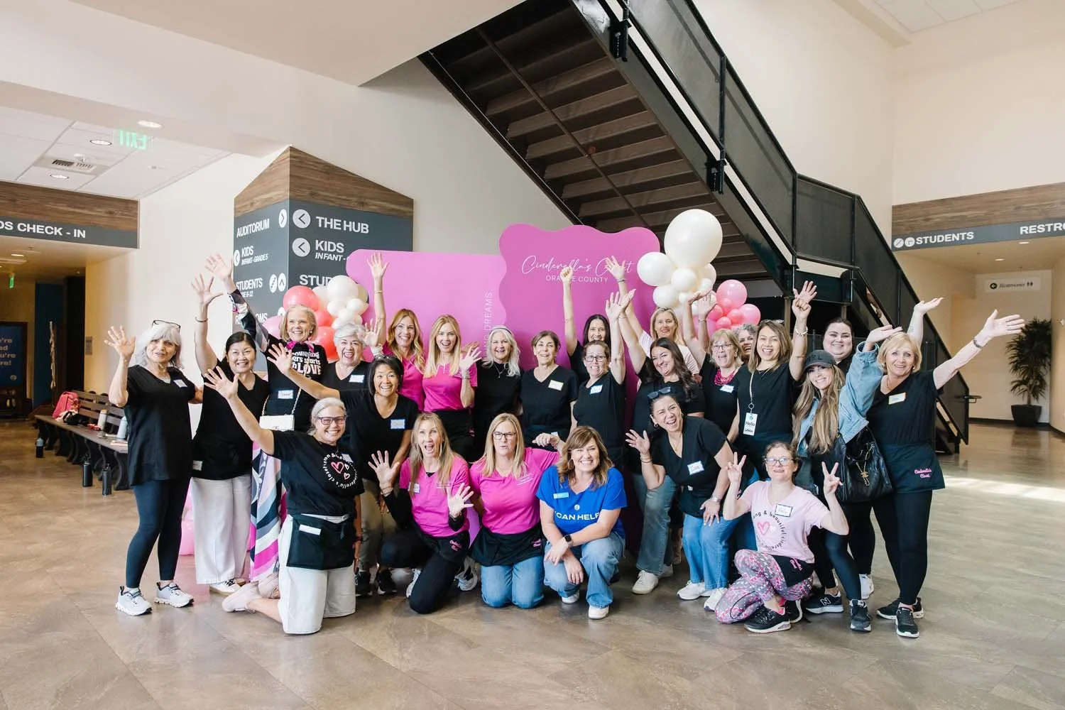 A group of women at a nonprofit event in Orange County for Cinderella's Closet stampeffect