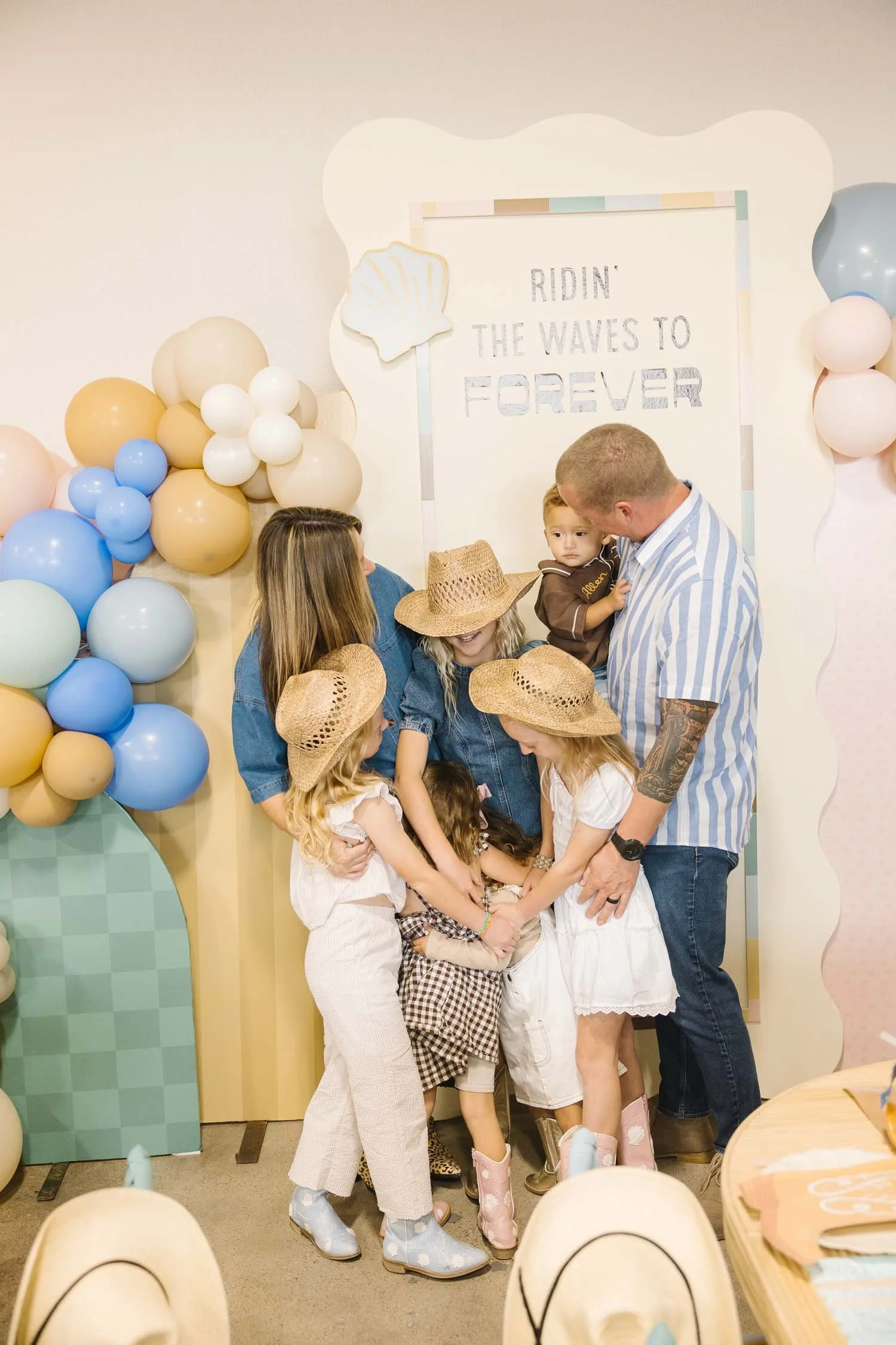 A family embracing during a birthday celebration