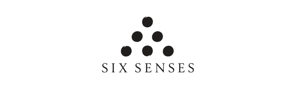 Six Senses logo with six grey circles arranged in a pyramid shape above the text.