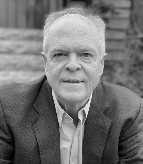 Older man in a suit, outdoors, black and white photo