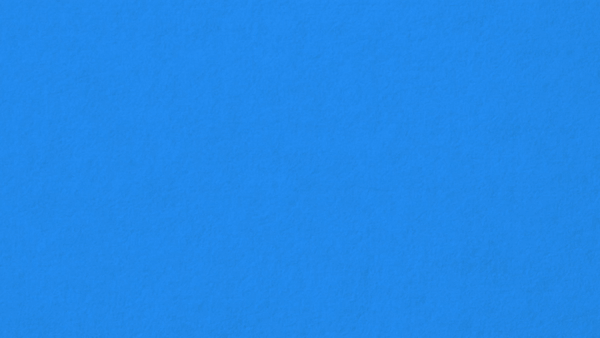 Solid blue textured wall or surface.