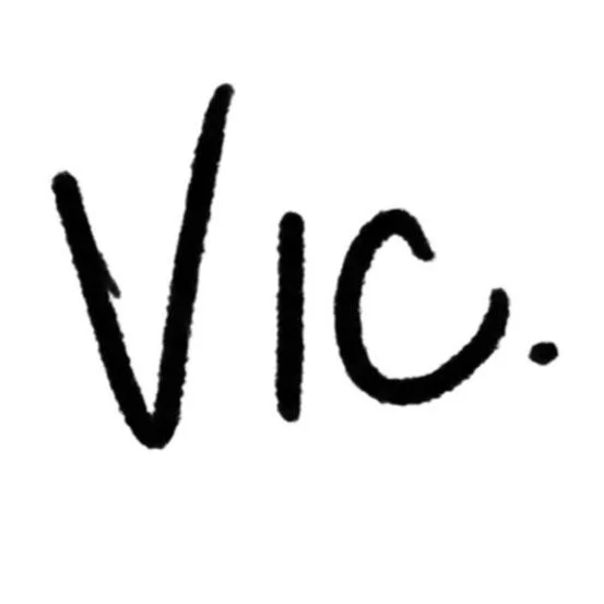 Handwritten text that says 'VIC' with a period