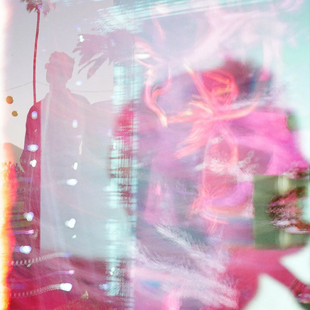 Reflected image of a person standing outdoors near palm trees, with pink and purple abstract lights and reflections overlaying the scene.