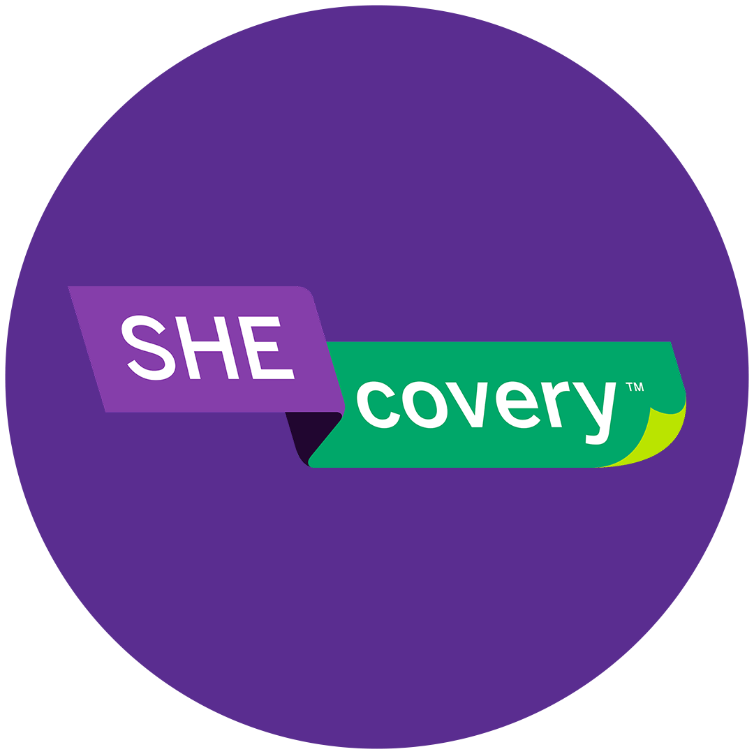A logo with the words "SHE covery" on a purple and green banner inside a purple circle.