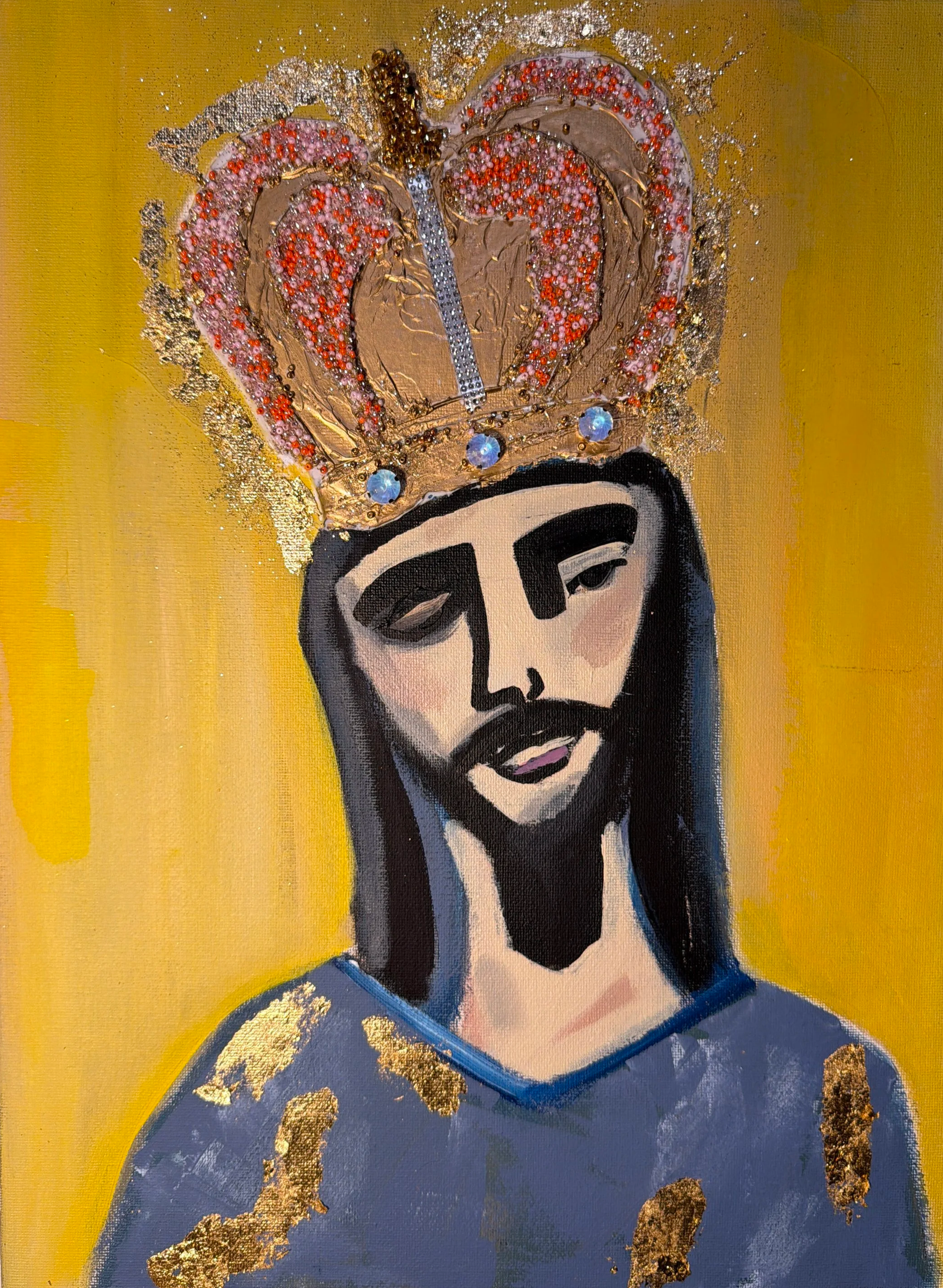 A modern, stylized portrait of Jesus Christ with a blue robe, dark hair, and a beard, portrayed against a yellow background. Gold accents and a crown are part of the artwork.