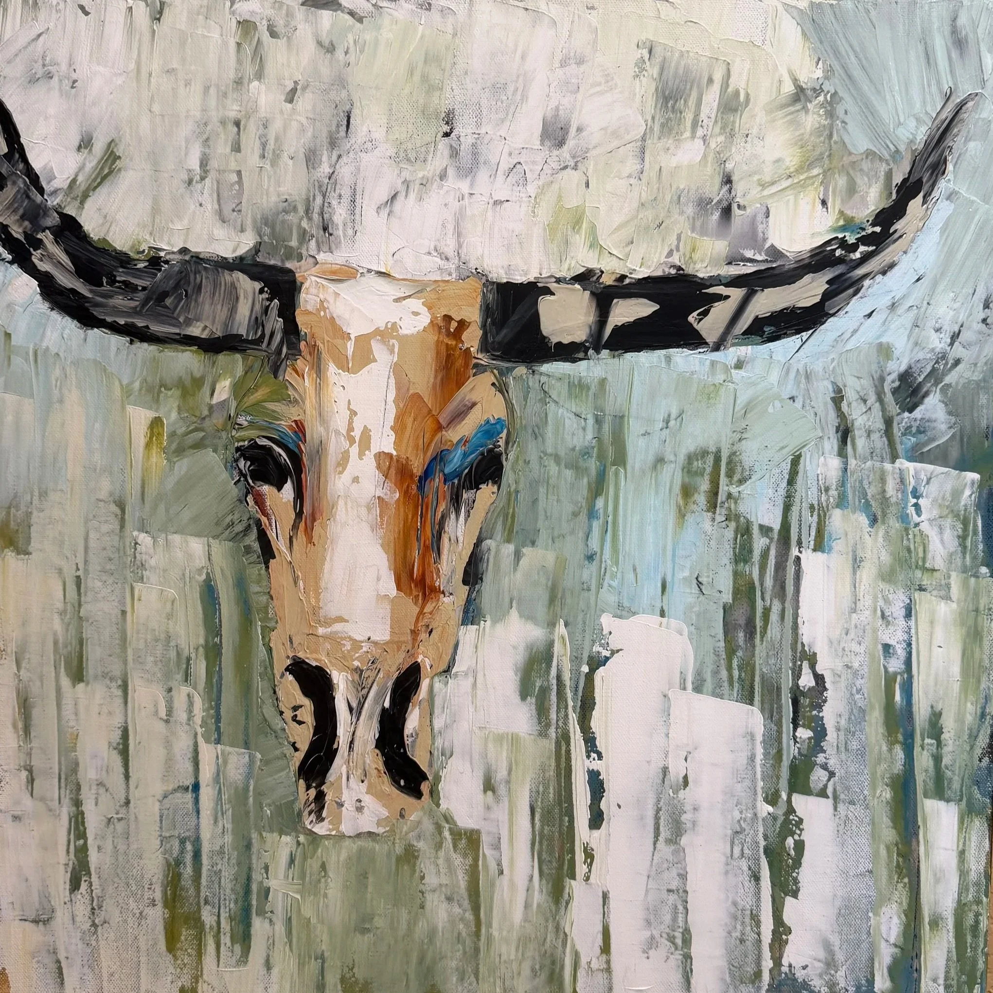 An abstract painting of a cow's head with black, white, and brown paint on canvas, with a background of greens, whites, and blues.