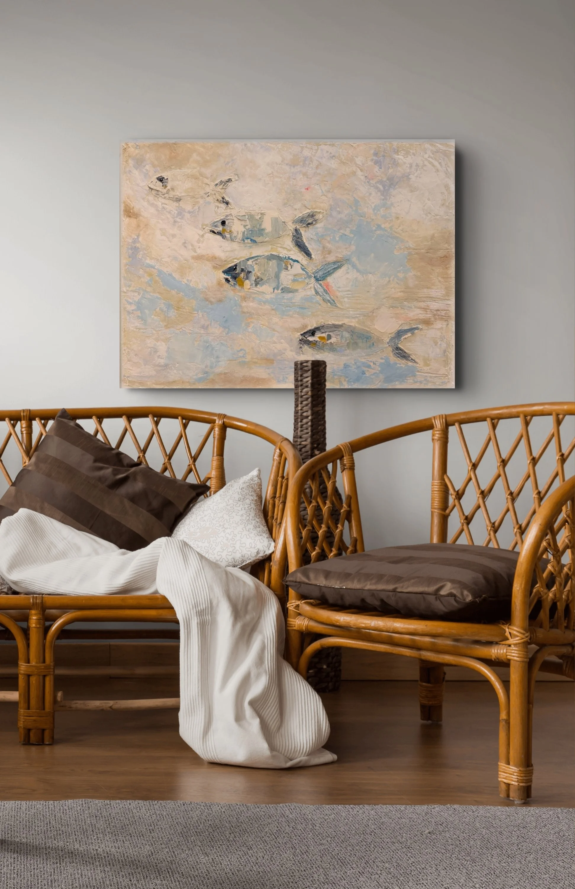 Bedroom with bamboo furniture, unmade bed with brown and white pillows, white blanket, and a large abstract painting of fish on the wall. A carpeted floor and wooden flooring are visible.