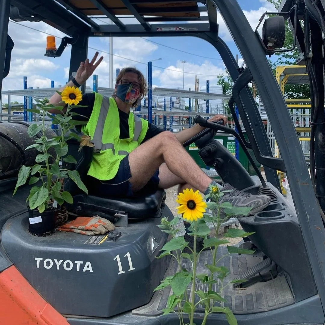 person in forklift smiling at tallgrass garden formerly christy webber farm & garden