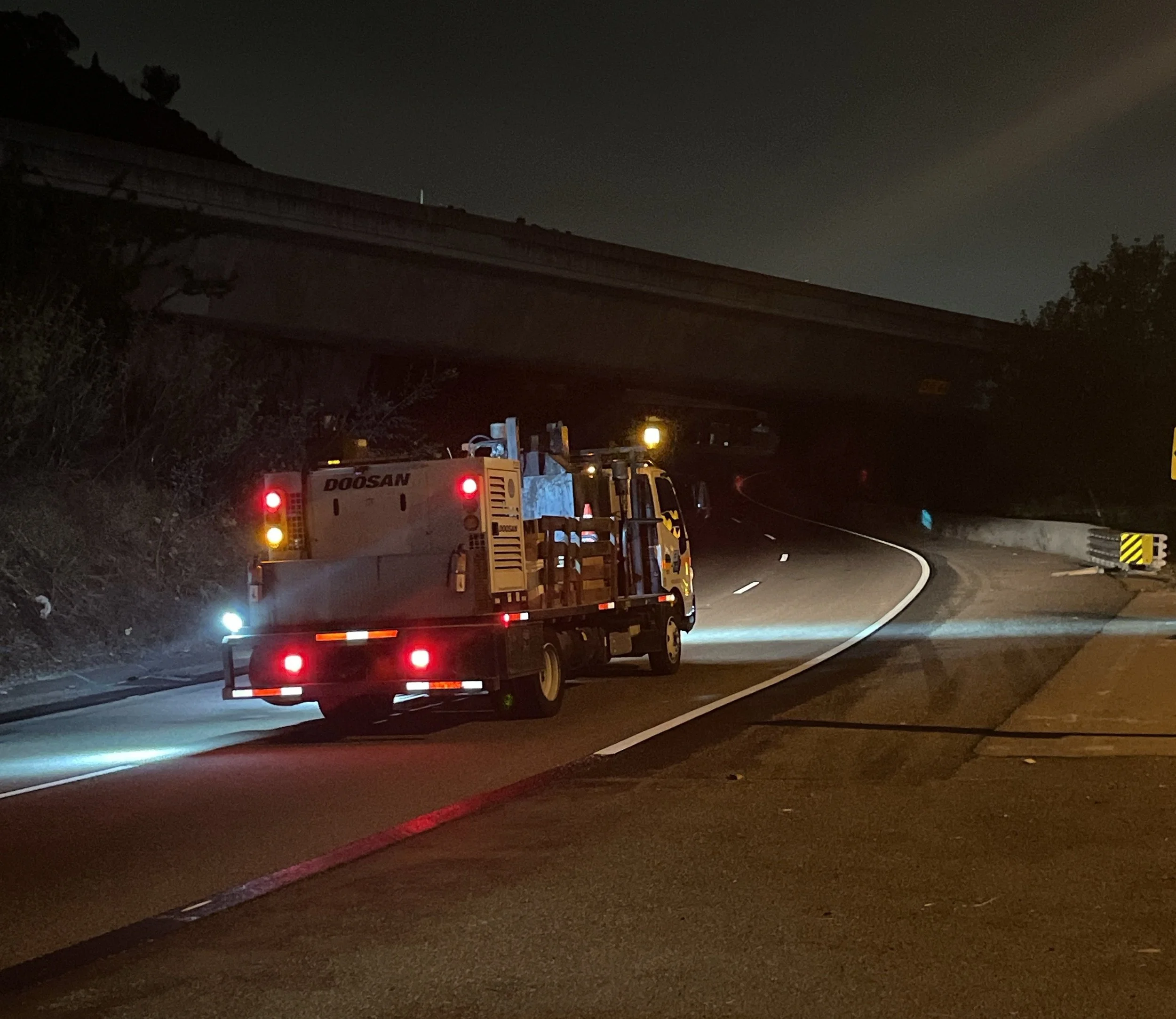 Freeway underpass roadwork at night