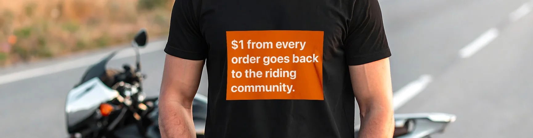 Close up of a motorcycle t-shirt with text about how Treadswear gives back.