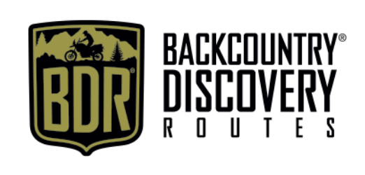 Backcountry Discovery Routes logo featuring an adventure motorcycle scene with trees, mountains, and a motorcyclist.