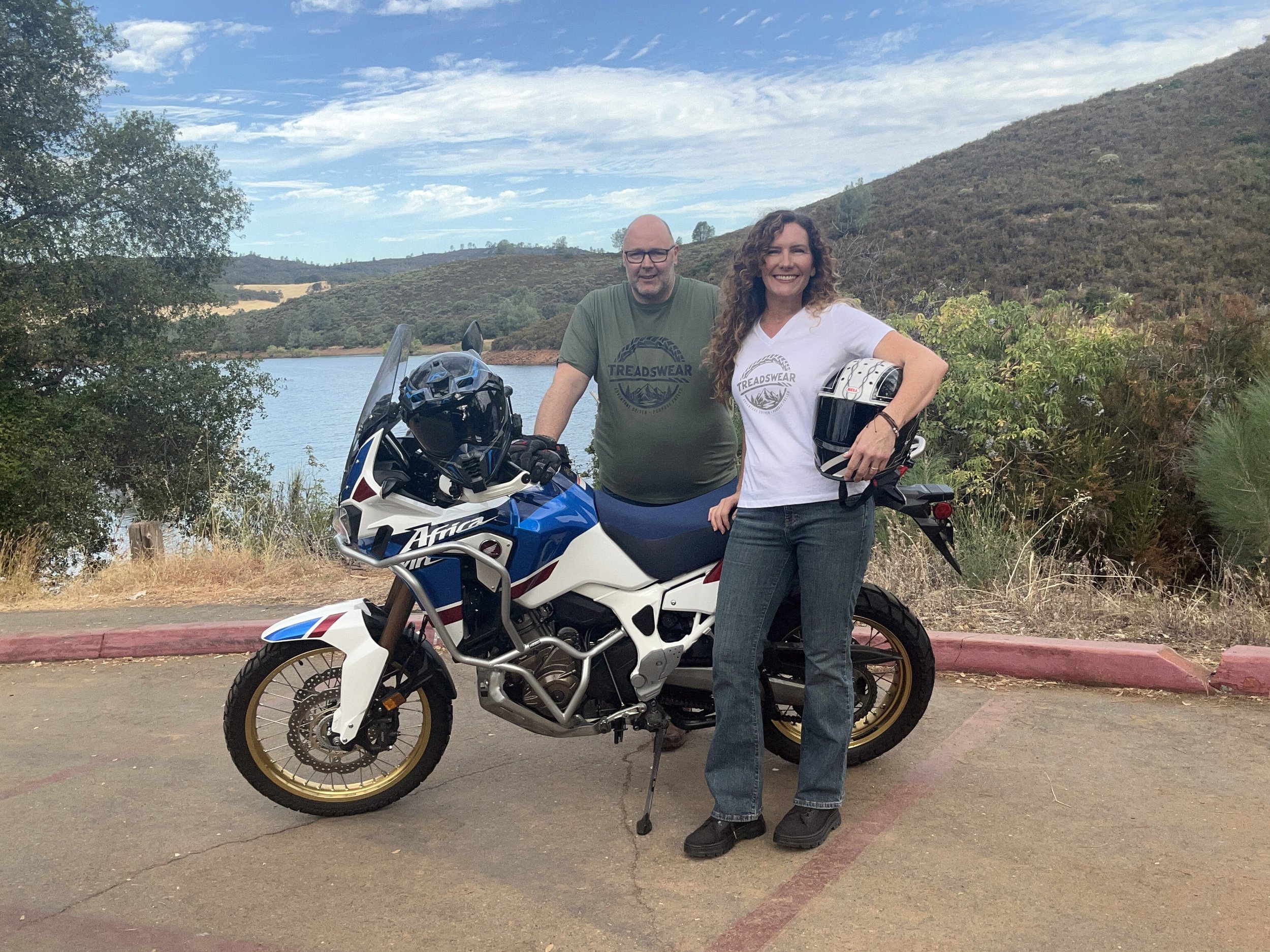 Treadswear owner's portrait with Honda Africa Twin motorcycle by the lake.