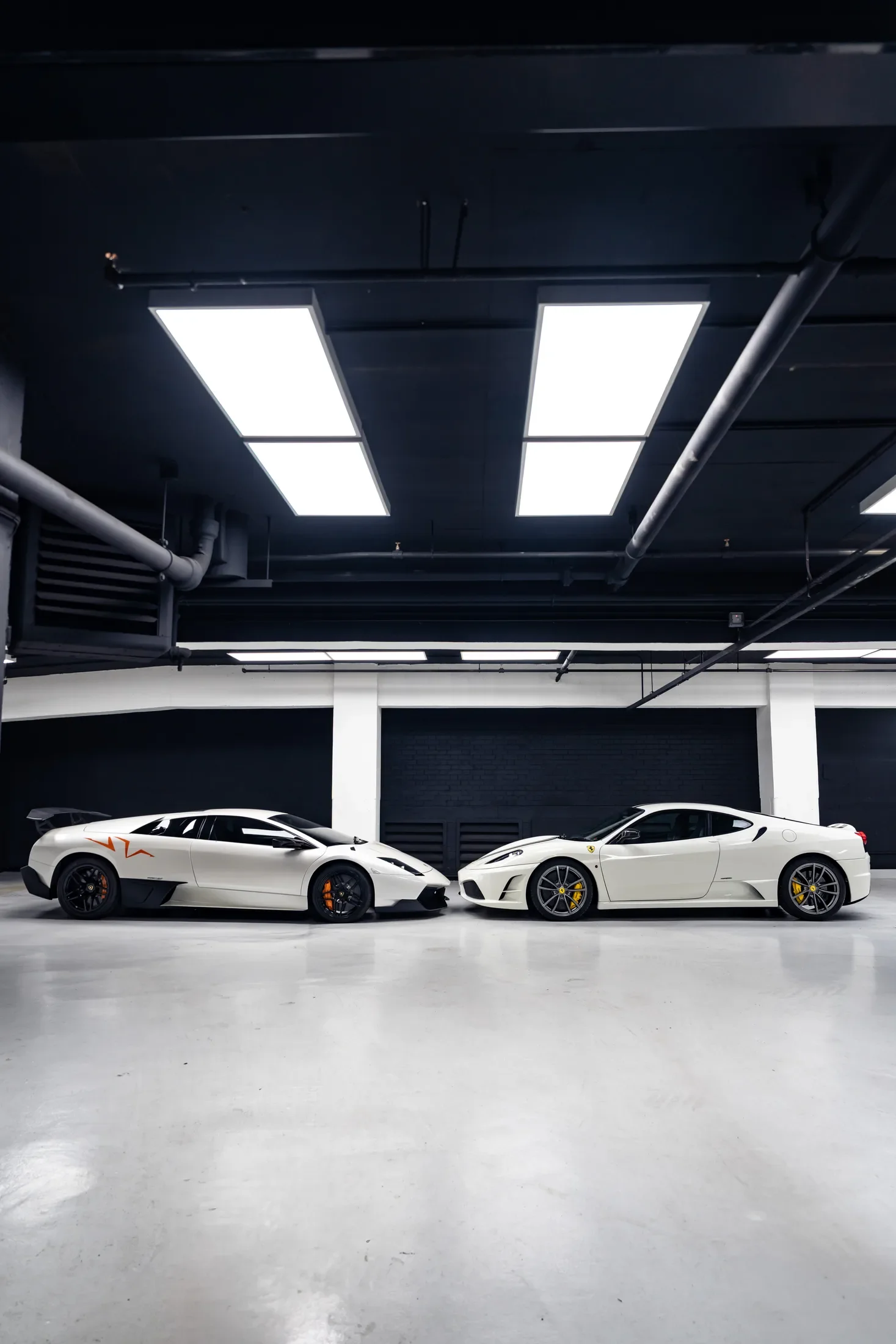 Performance car collection in a private garage — AKC Asset Management.