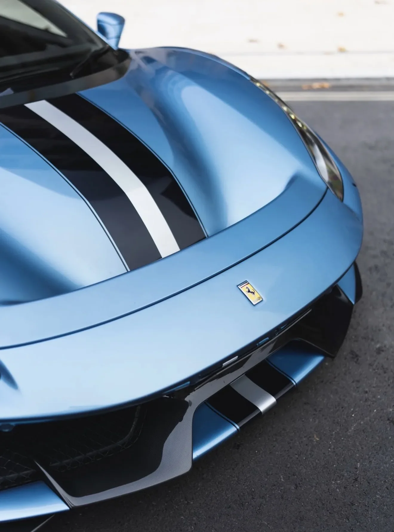 Ferrari 488 Pista in Azzurro California — Striped bonnet and front bumper detail — AKC Asset Management.