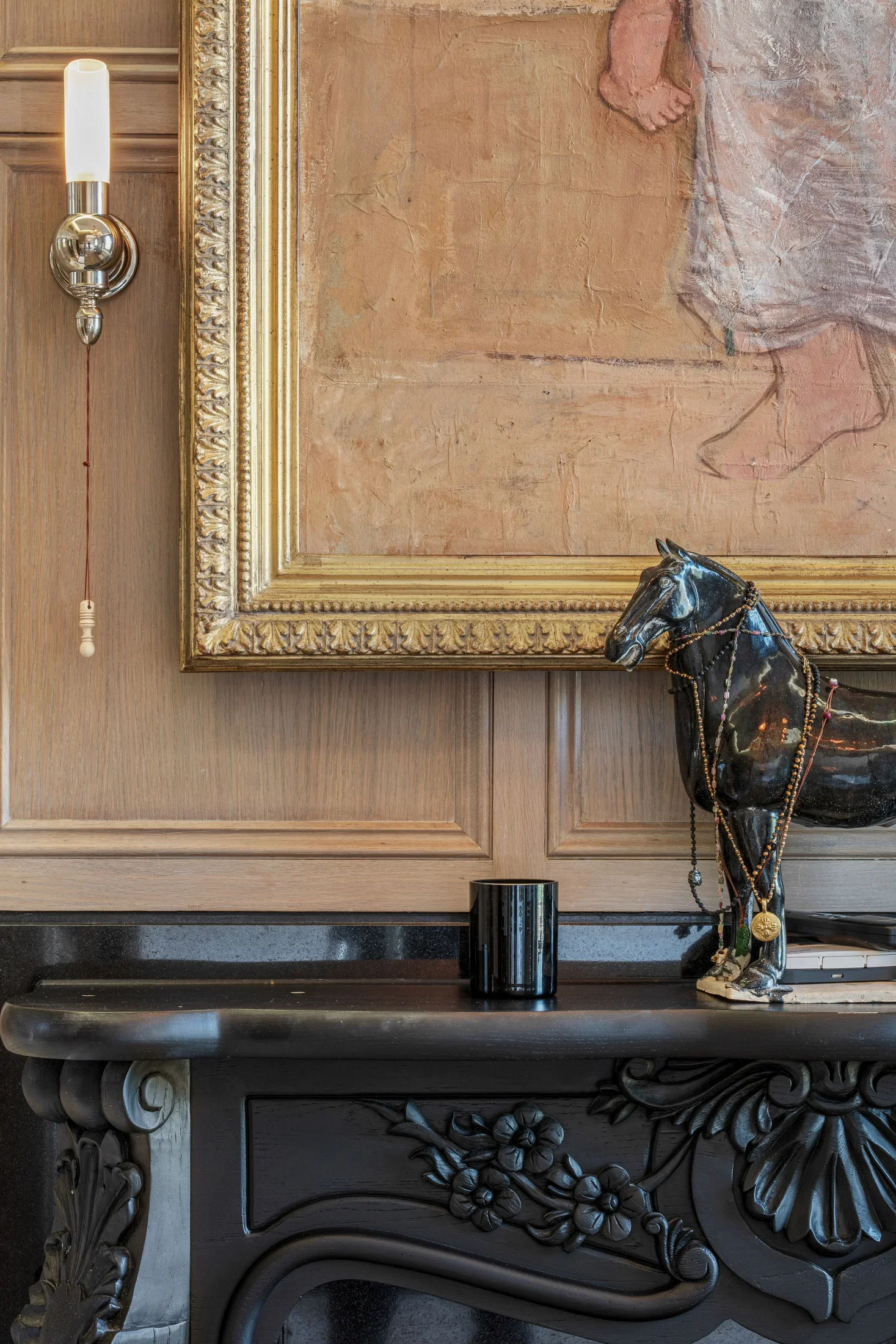 Detail of a gilt-framed painting with a decorative horse sculpture — AKC Asset Management art collection services.