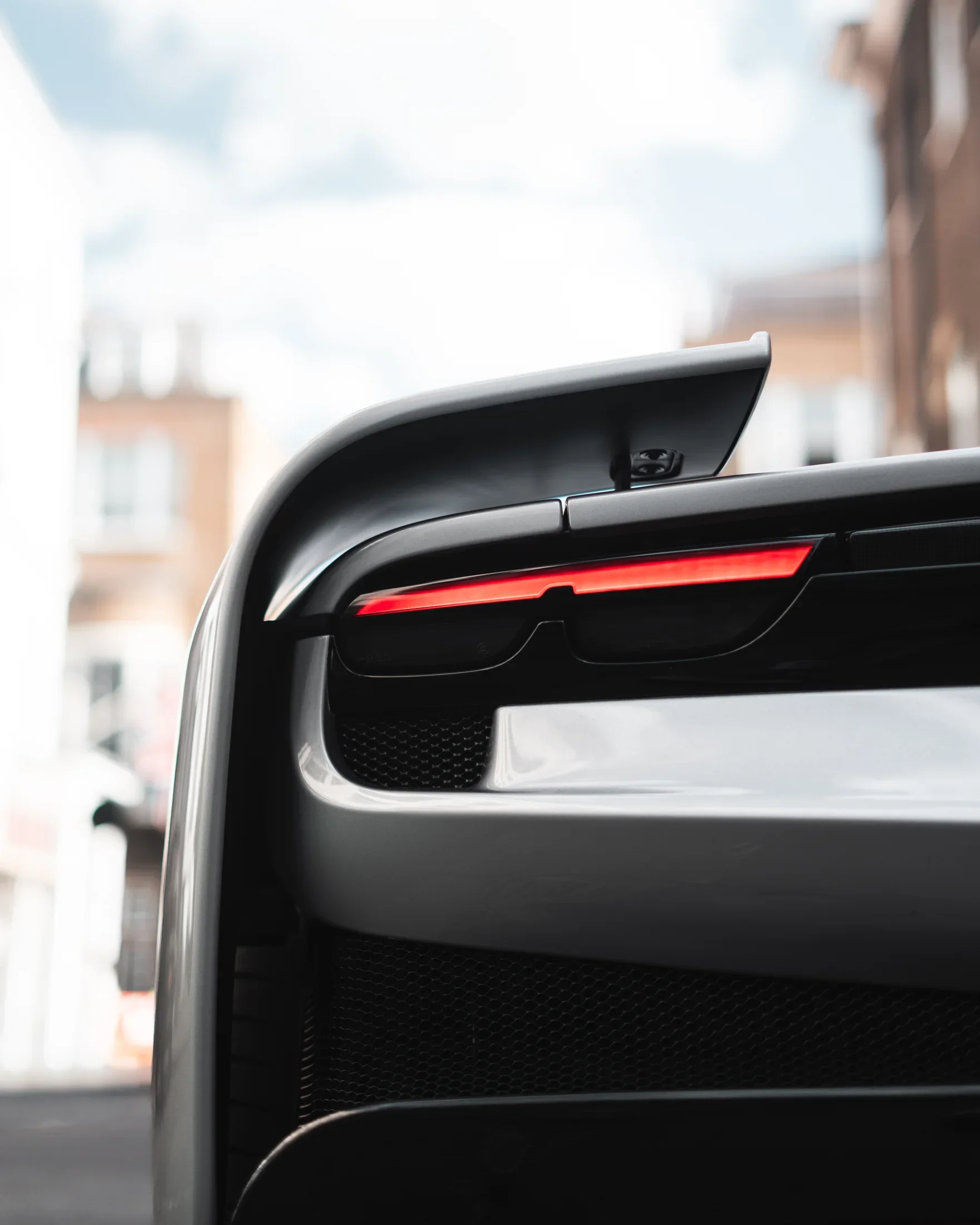 Ferrari 296 Speciale in Argento Nürburgring — Rear light and spoiler detail — AKC Asset Management.