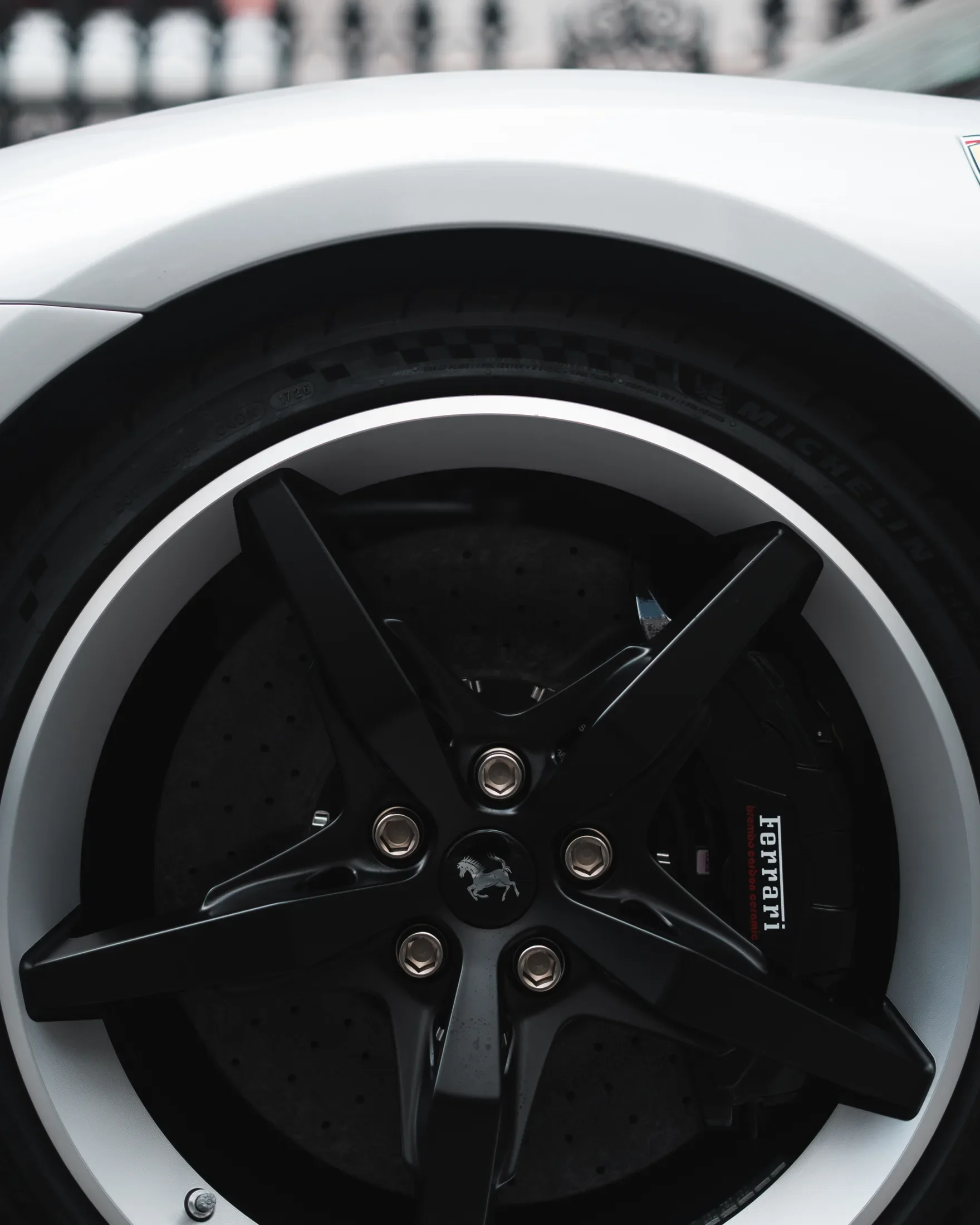 Ferrari 296 Speciale in Argento Nürburgring — Black alloy wheel and centre badge — AKC Asset Management.