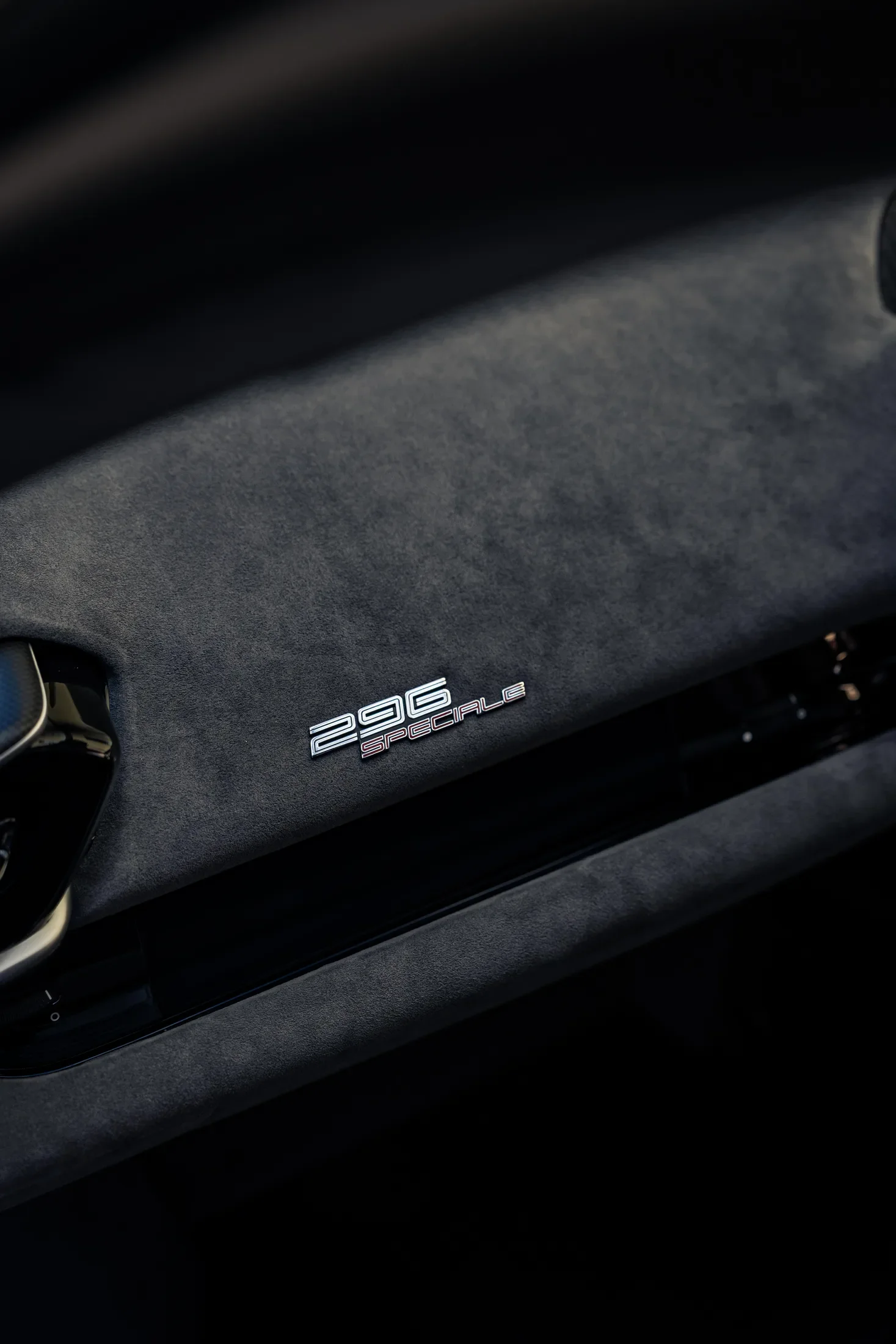Ferrari 296 Speciale in Argento Nürburgring — Interior trim and model badge — AKC Asset Management.