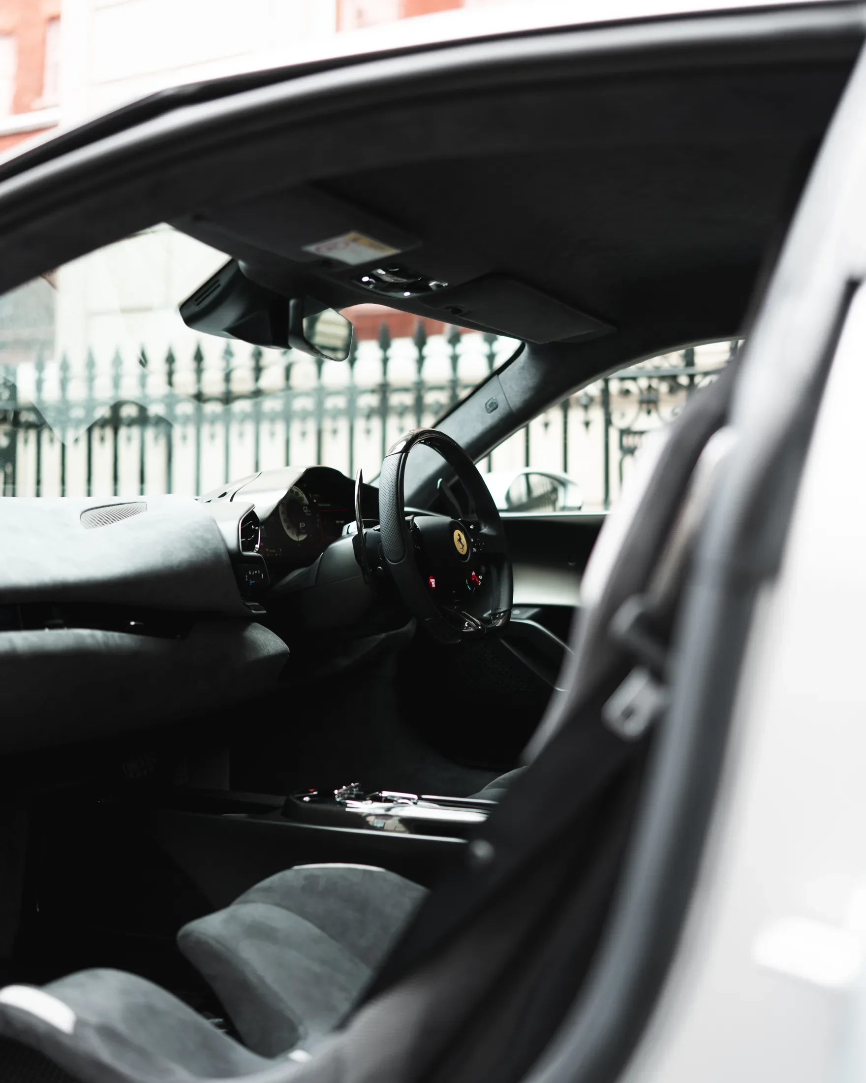 Ferrari 296 Speciale in Argento Nürburgring — Cabin viewed through an open door — AKC Asset Management.