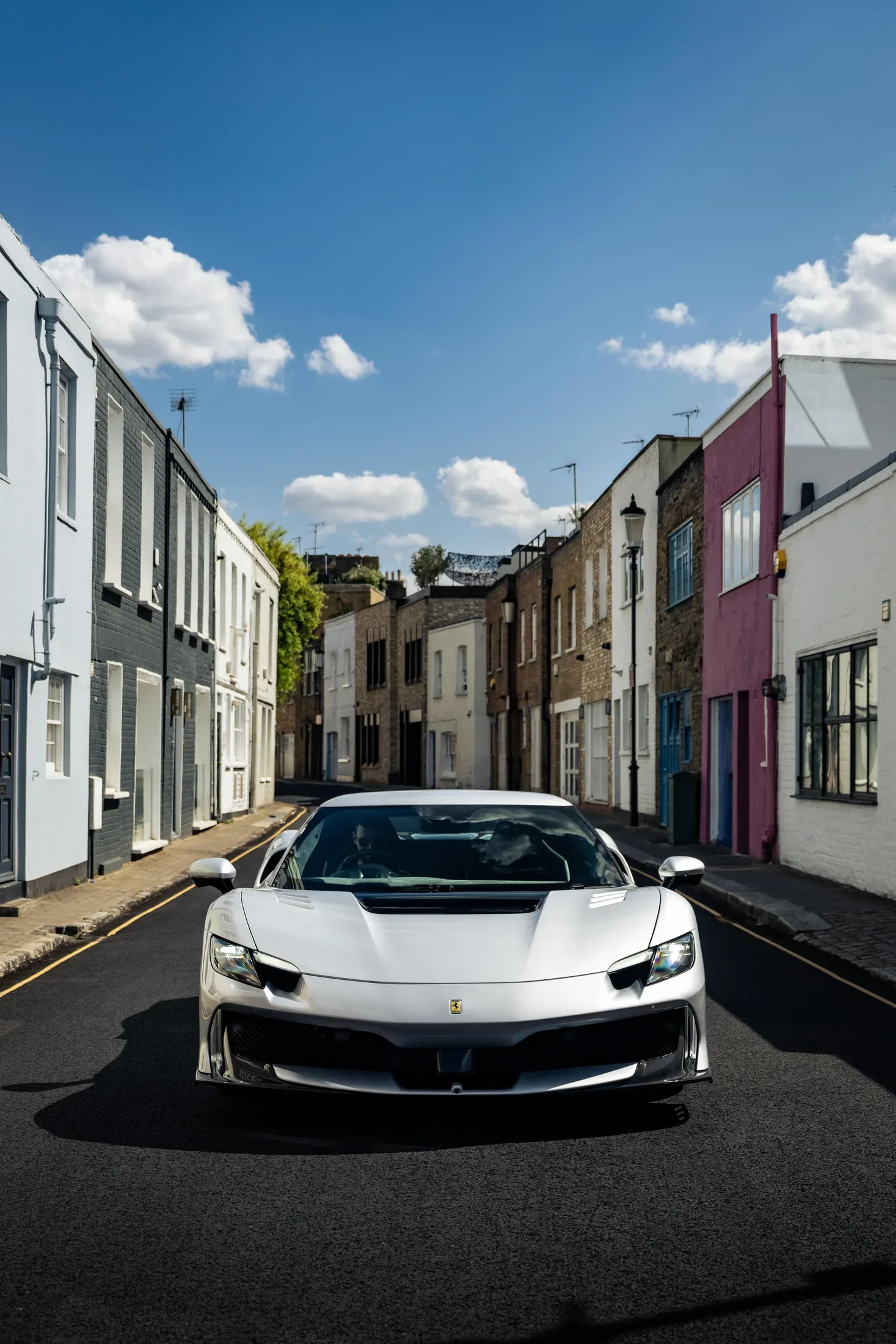 Ferrari 296 Speciale in Argento Nürburgring — Front view on a narrow street — AKC Asset Management.