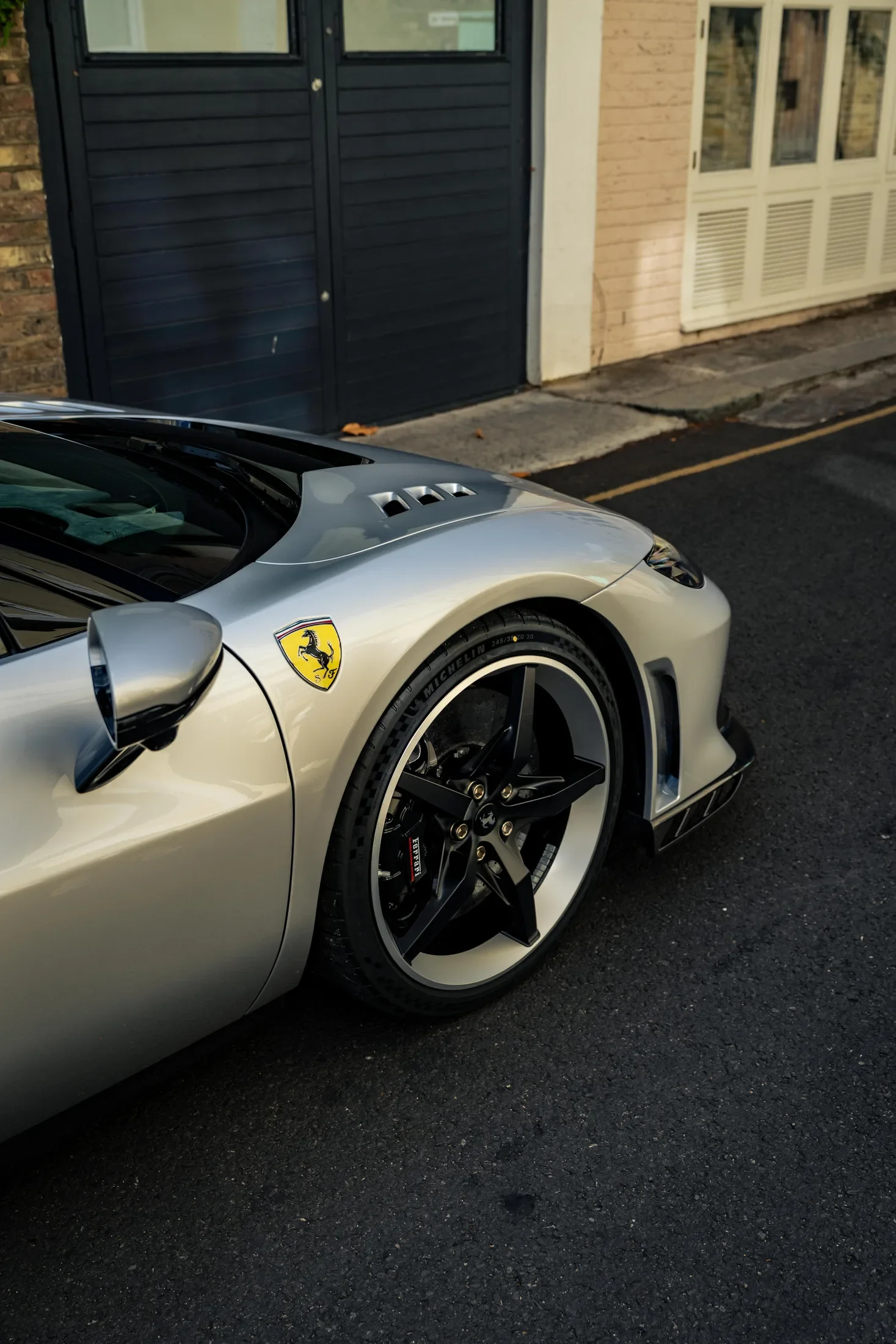 Ferrari 296 Speciale in Argento Nürburgring — Front wheel and wing badge — AKC Asset Management.
