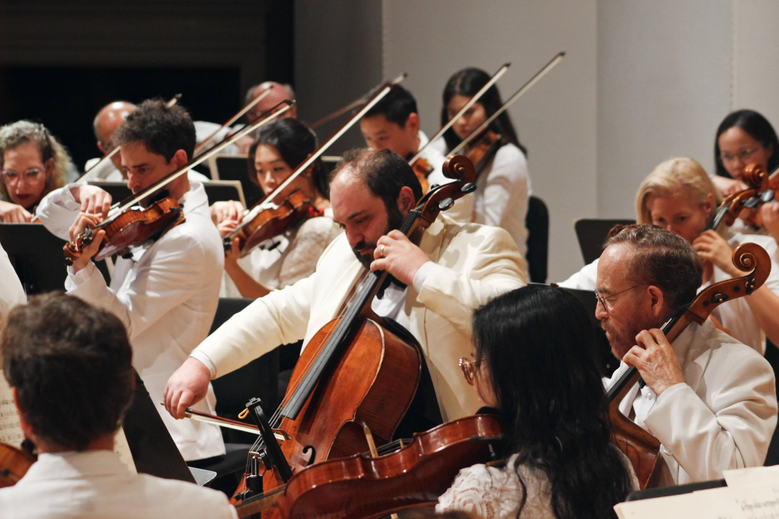 Julian Schwarz playing the cello in the Eastern Festival Orchestra as a part of the Eastern Festival of Music.