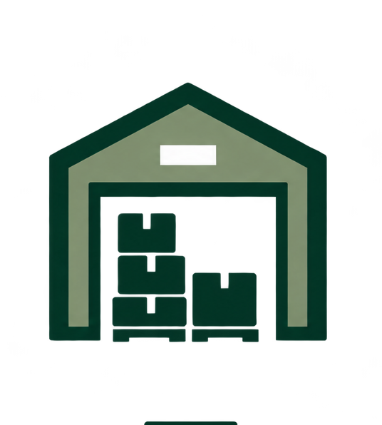 A green and beige warehouse with a peaked roof and open entrance, containing stacked boxes or crates inside.
