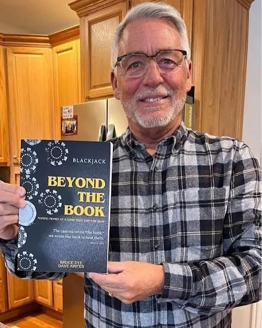 David Krites holding Beyond the Book, the blackjack book he co-authored with Bruce Dye.