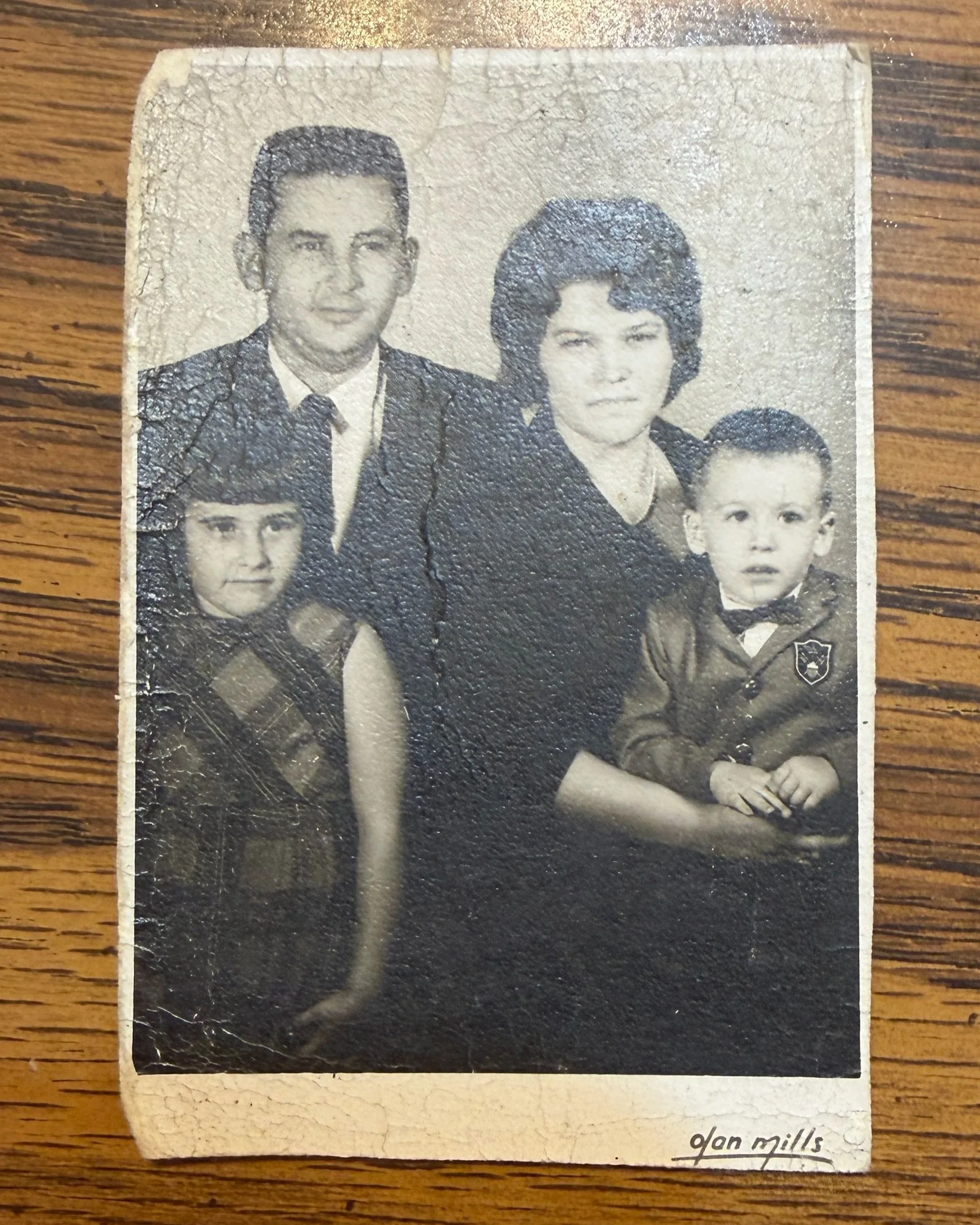 Childhood family photograph of Marcia Krites with her parents and brother.