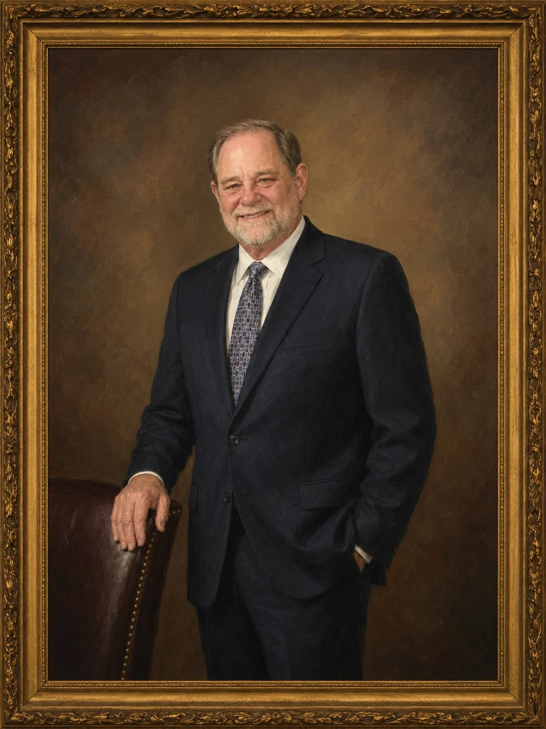Portrait of an elderly man with gray hair and beard, dressed in a dark suit with a patterned tie, standing with his hand on the back of a leather chair, in front of a brown background with an ornate gold frame.