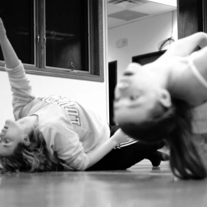 Dance instructor and student rehearsing