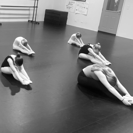 Dance coach leading warmups