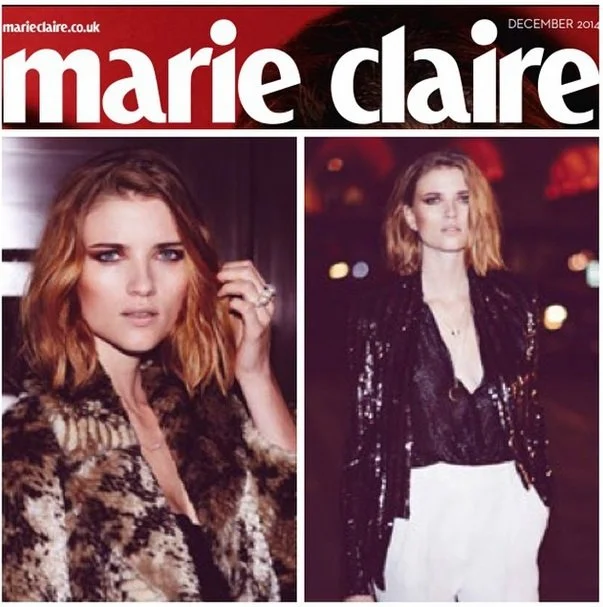 Marie Claire magazine cover from December 2014 featuring model Emma Stone in two photos, one close-up and one full-body shot, with a dark nighttime background.