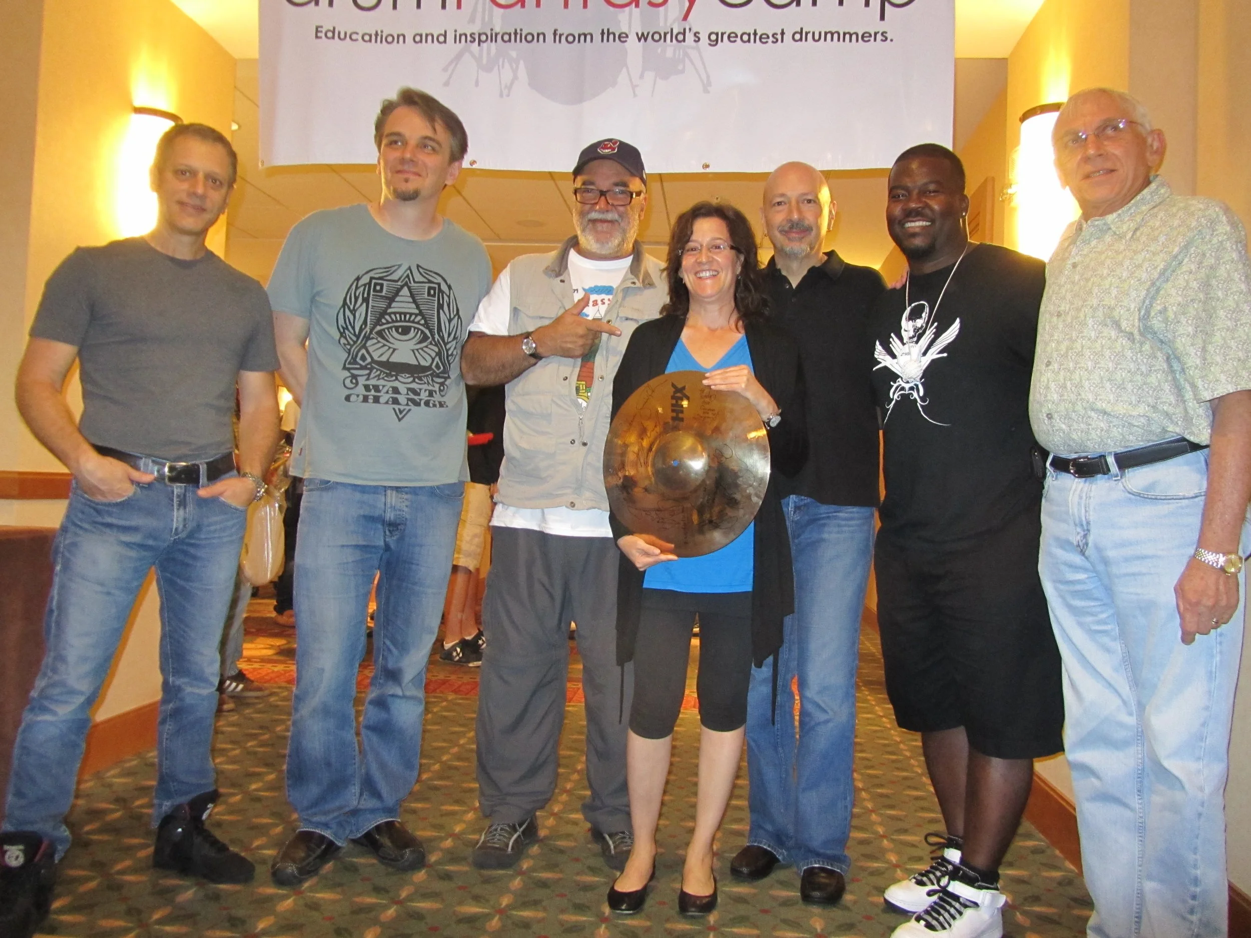 The instructors present a cymbal to attendee Linda Bogot