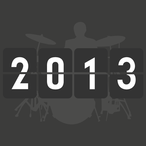 A digital calendar displaying the year 2013 over a silhouette of a drummer playing a drum kit.