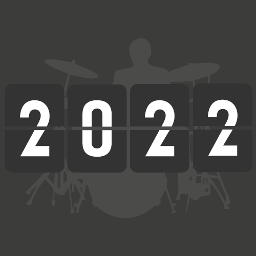 Digital clock displaying 2022 over a silhouette of a person playing drums.