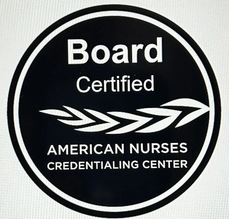 A circular badge with a black background and white text that reads "Board Certified American Nurses Credentialing Center" with a white arrow design. Board Certified Nurse Executive- Advanced