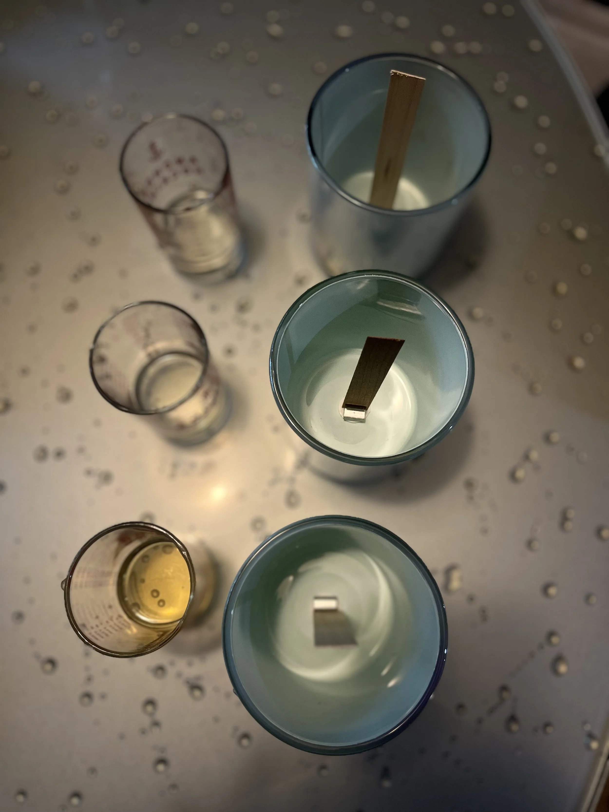 Vibes UnMatched coconut apricot crème wax candle undergoing wooden wick testing.