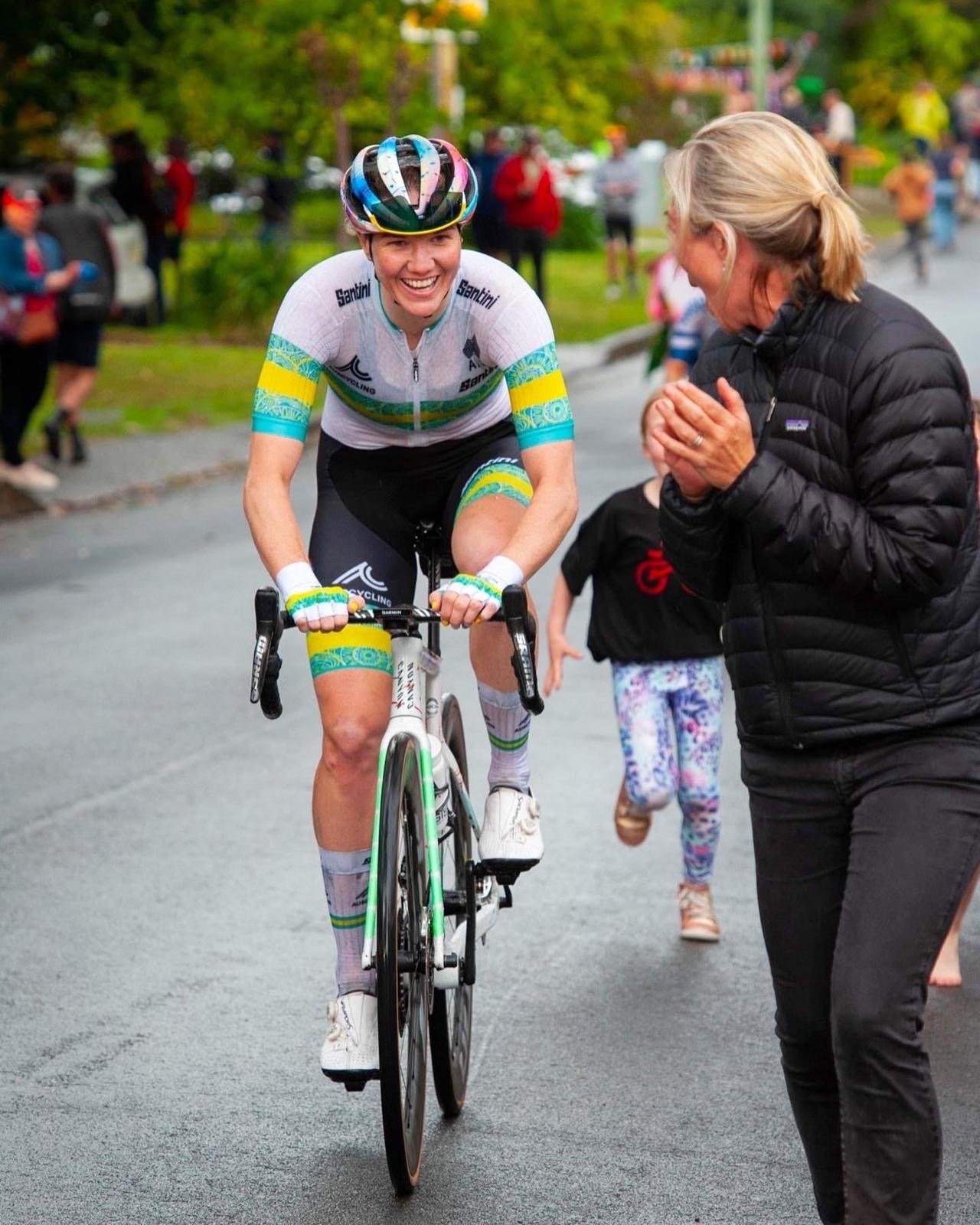 Natalie Kaebisch cheering a rider in the Australian champion's jersey
