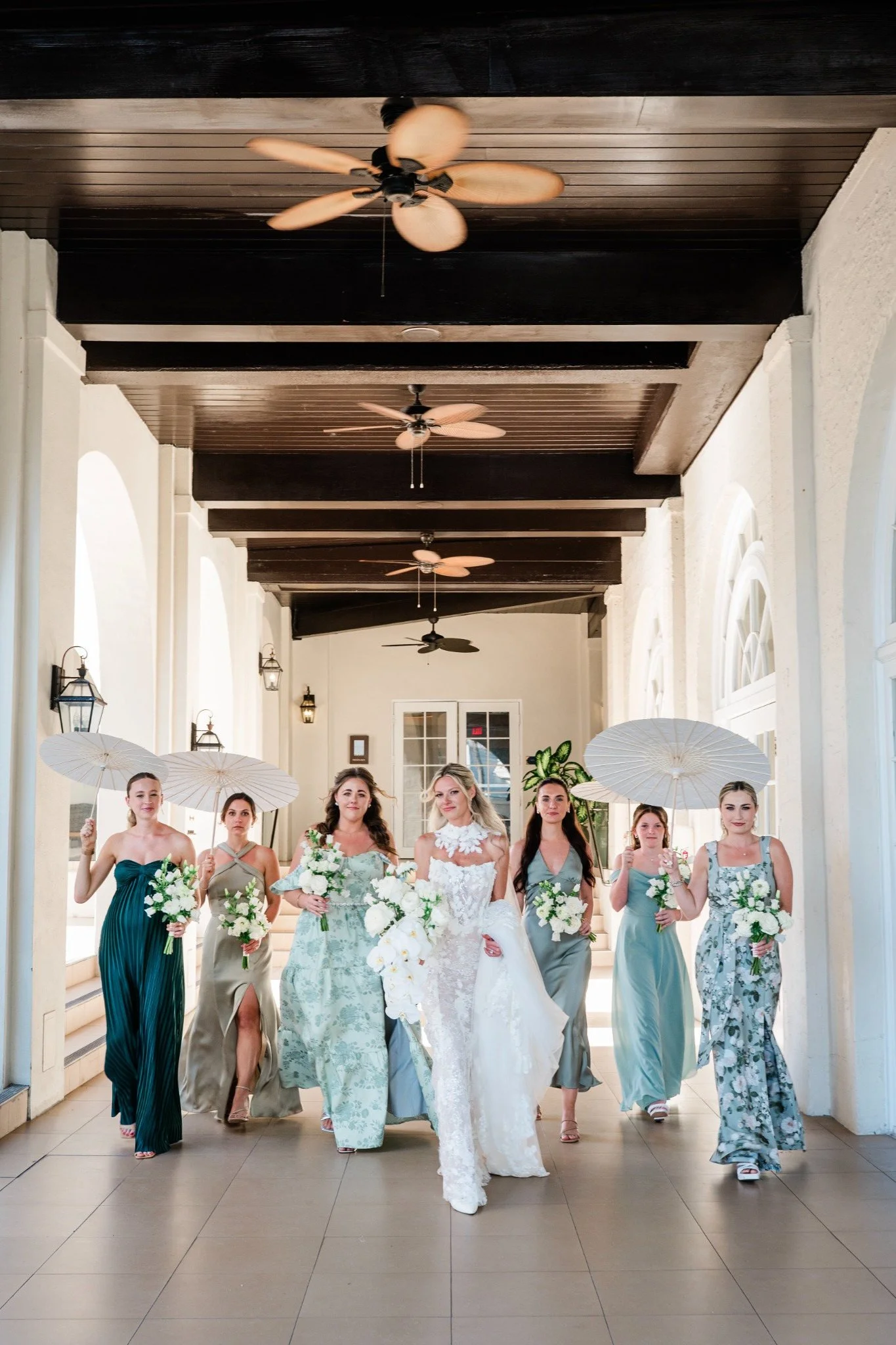 casa-marina-bridesmaids-walking-corridor.jpg