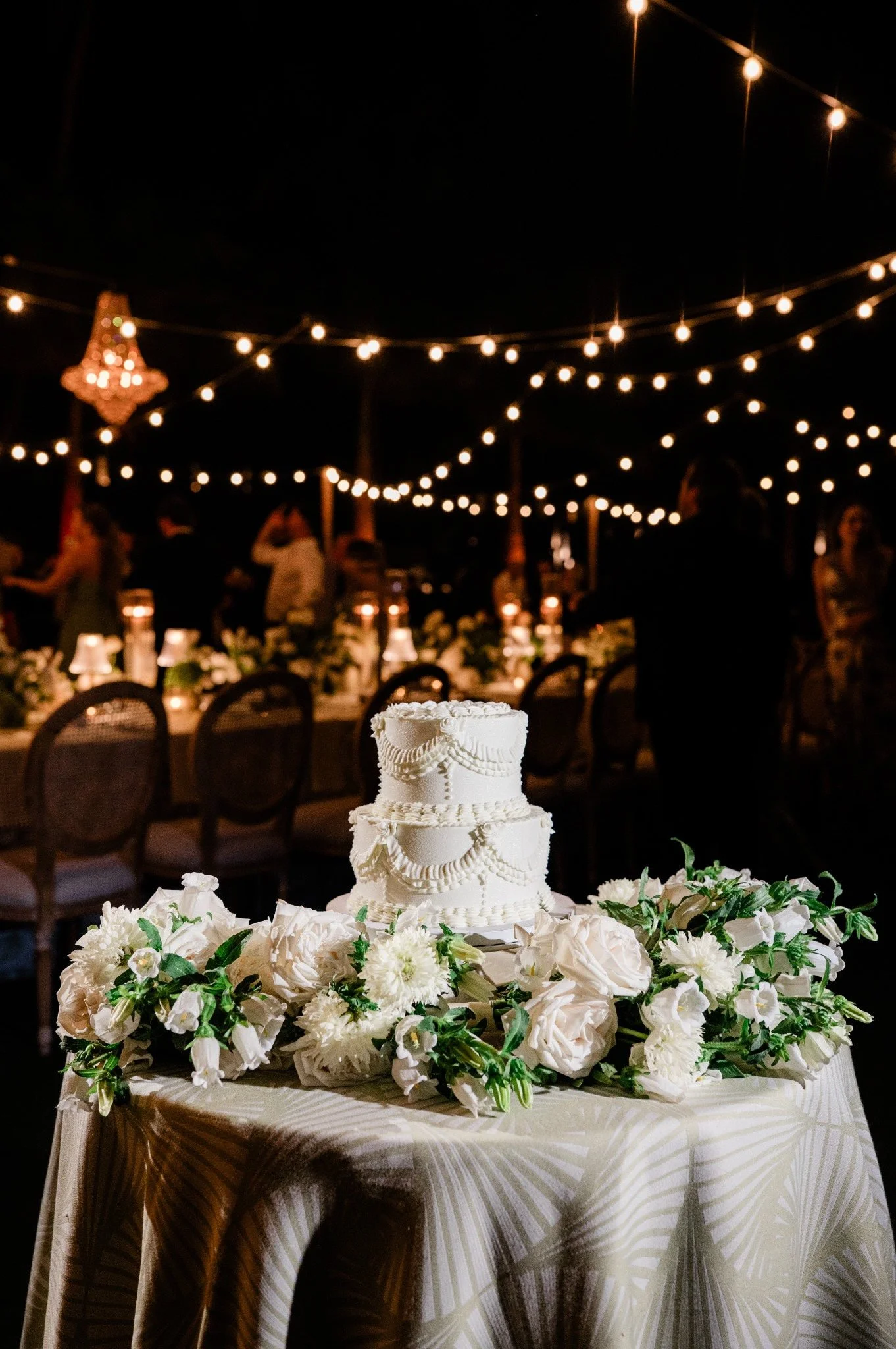 casa-marina-evening-wedding-cake-string-lights.jpg