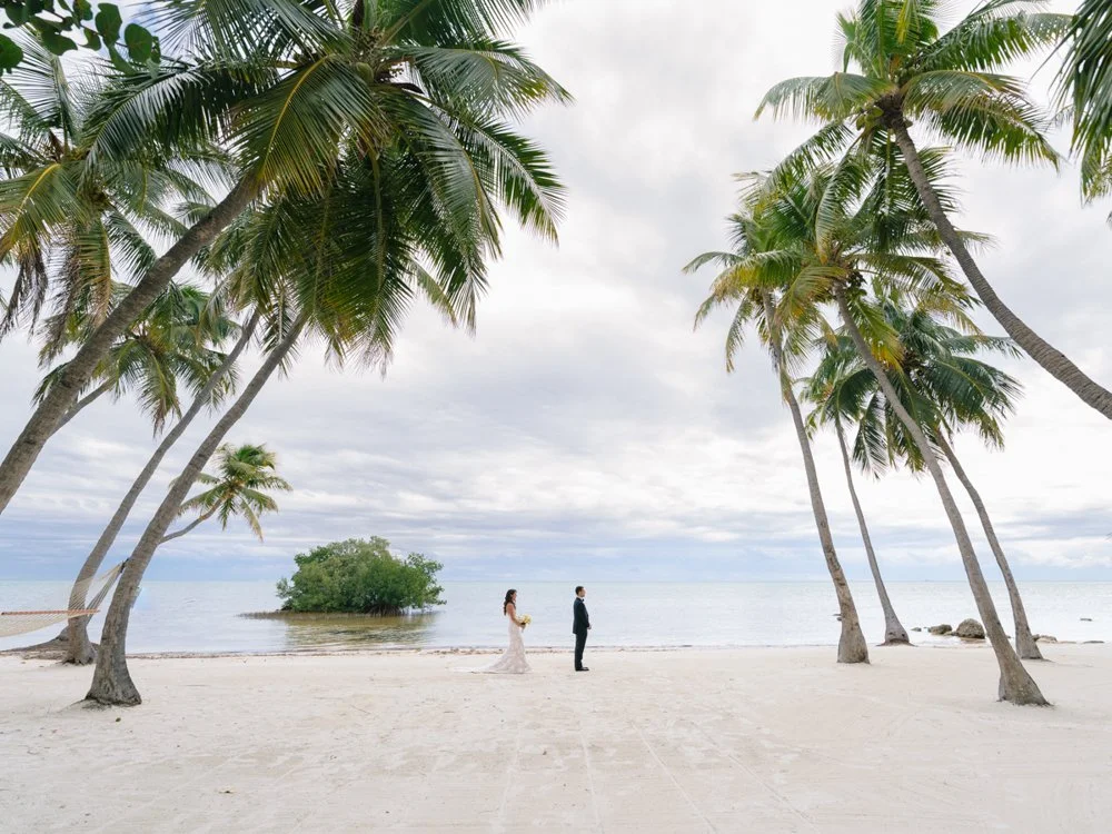 pierres-morada-bay-islamorada-bride-groom-first-look-palm-tree-beach.jpg
