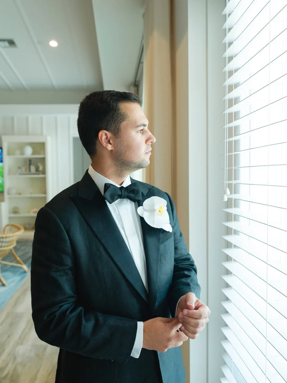 pierres-morada-bay-islamorada-groom-getting-ready-black-tuxedo.jpg