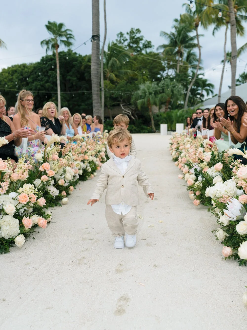 pierres-morada-bay-islamorada-ring-bearer-walking-flower-lined-aisle.jpg