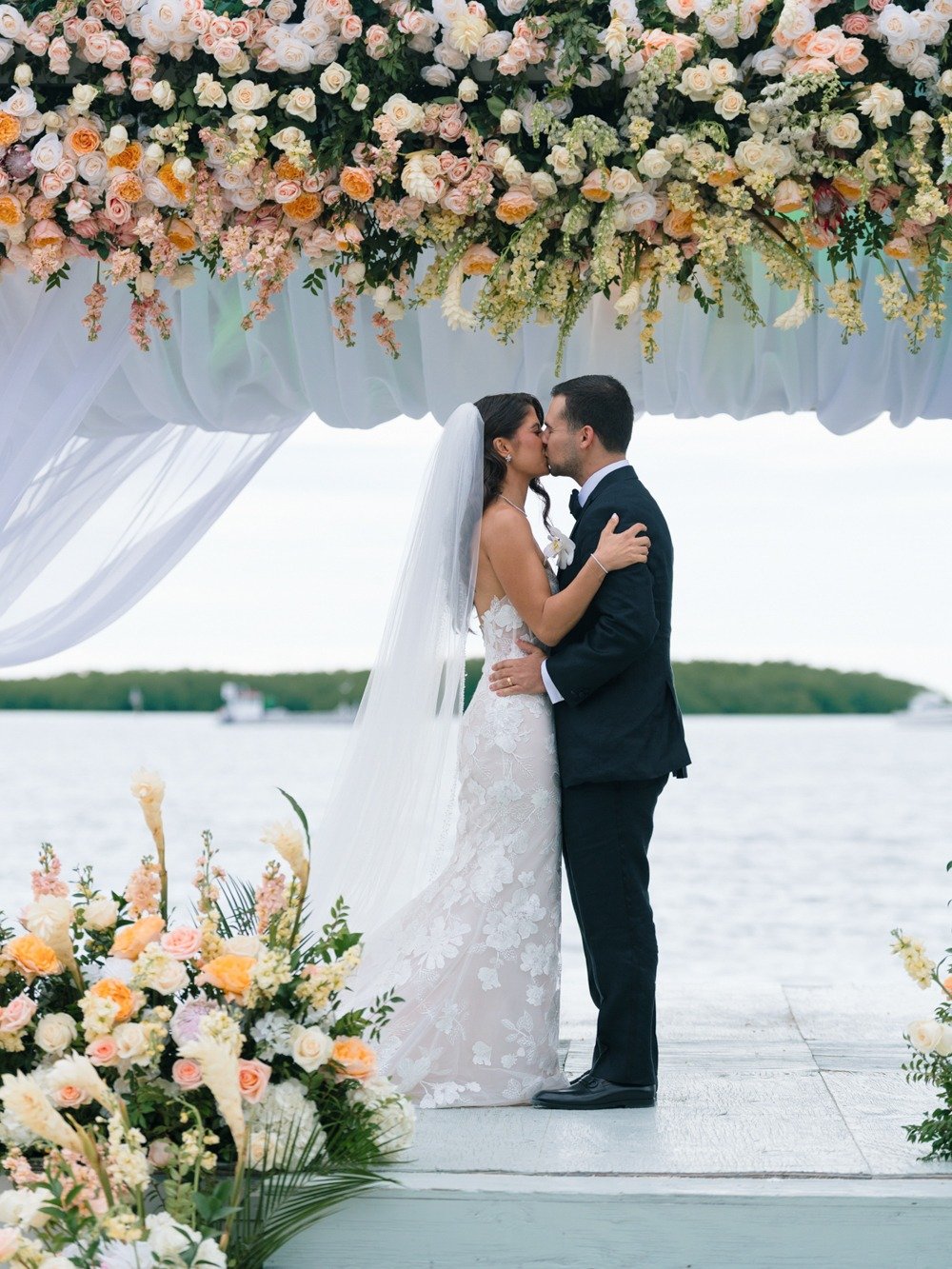 pierres-morada-bay-islamorada-wedding-couple-kissing-waterfront.jpg