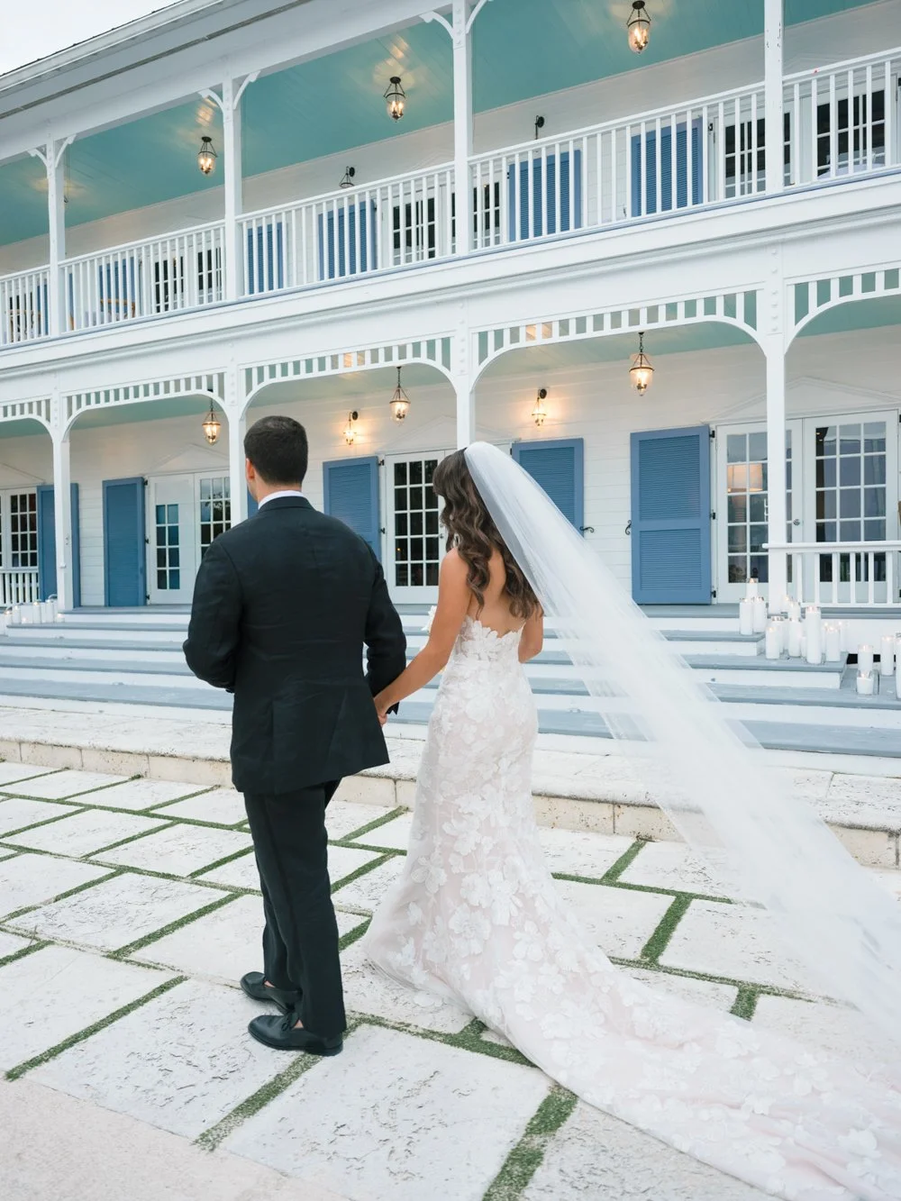 pierres-morada-bay-islamorada-wedding-couple-walking-veranda.jpg