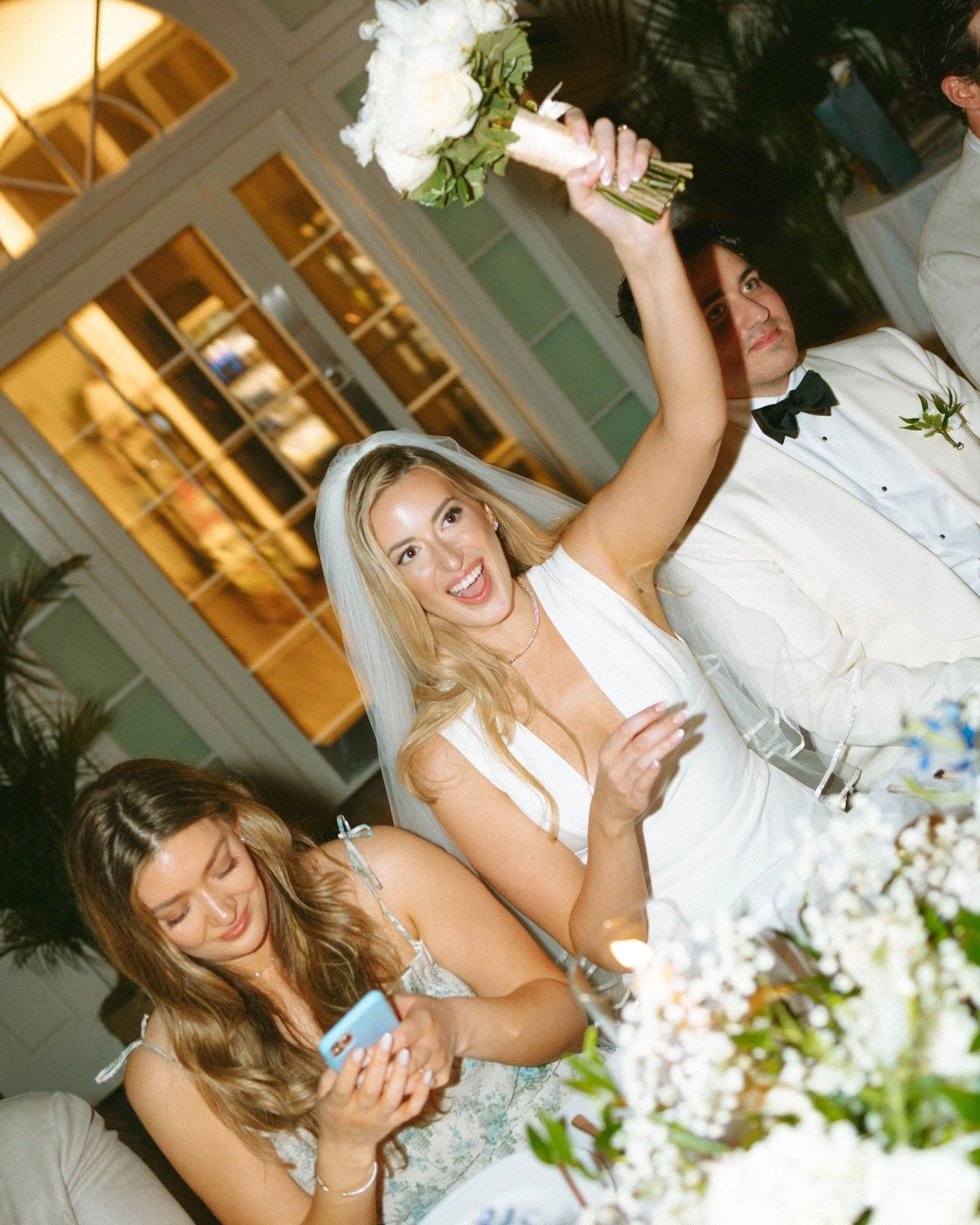 casa-marina-key-west-wedding-bride-celebrating-with-bouquet.jpg