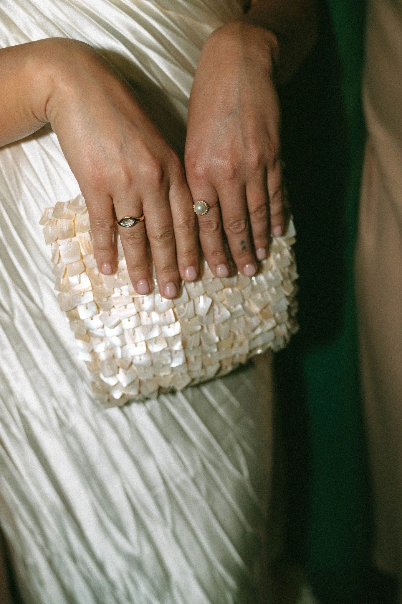 key-west-bride-pearl-clutch-wedding-rings-detail.jpg